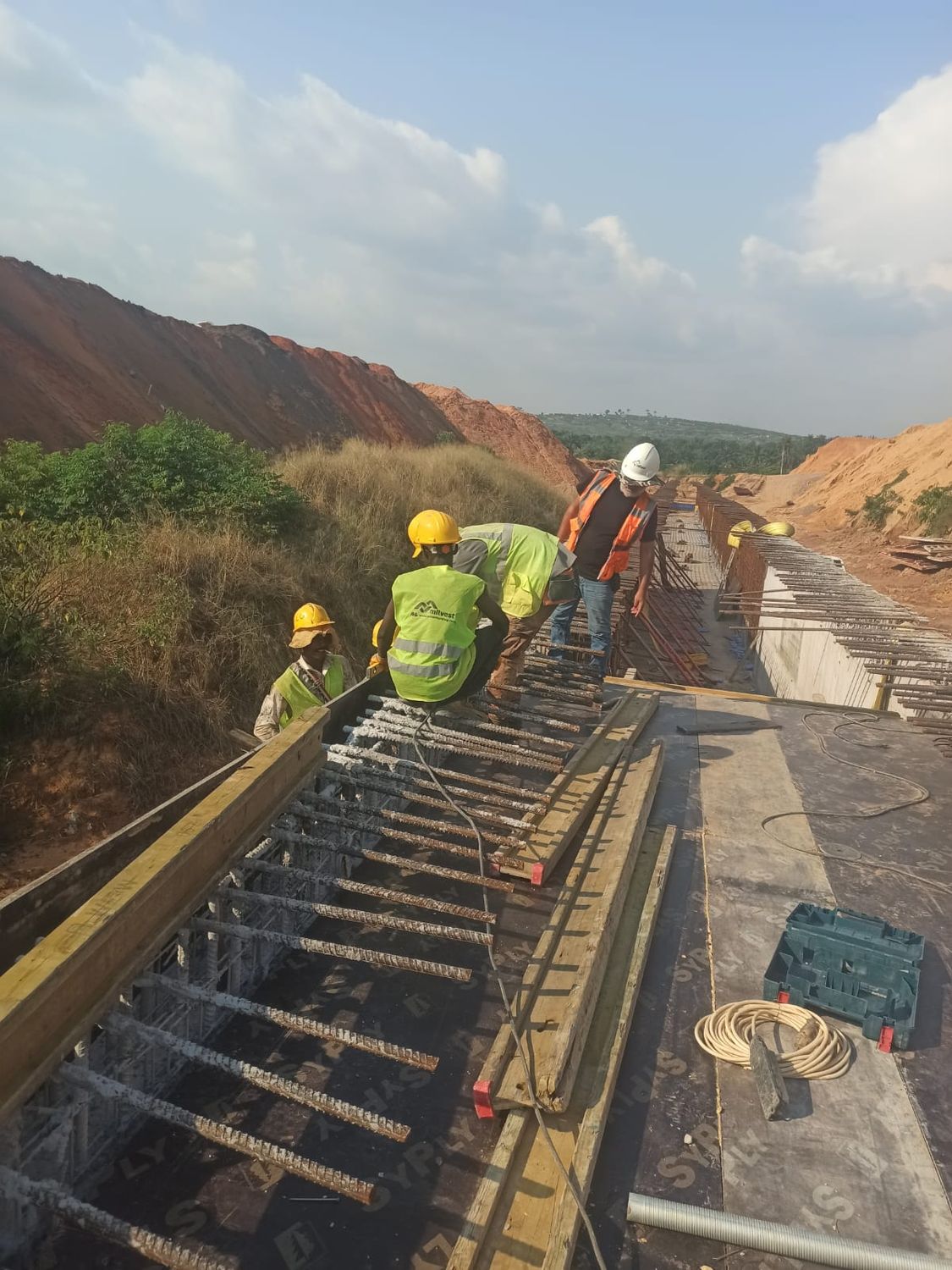 Formwork crew and foreman on a road and bridge construction project