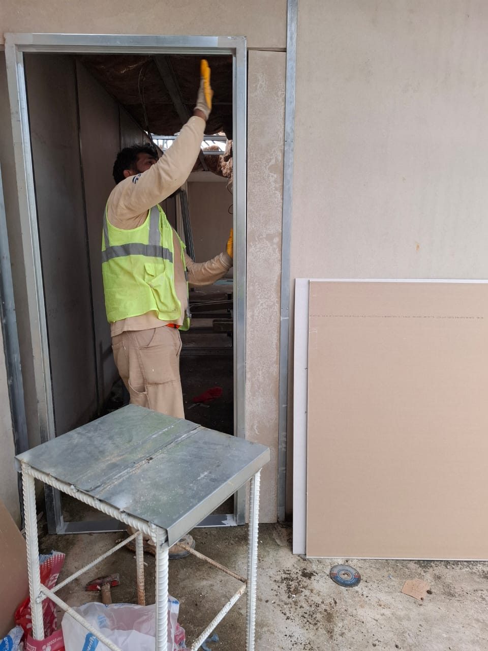Door frame fitting on drywall partitions