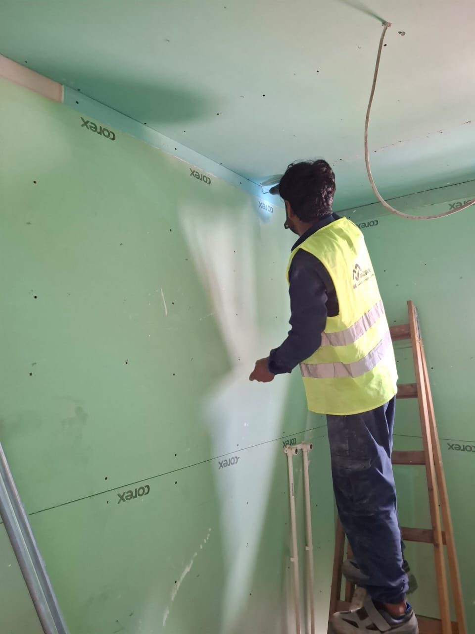 Drywall finishing inside a prefab unit