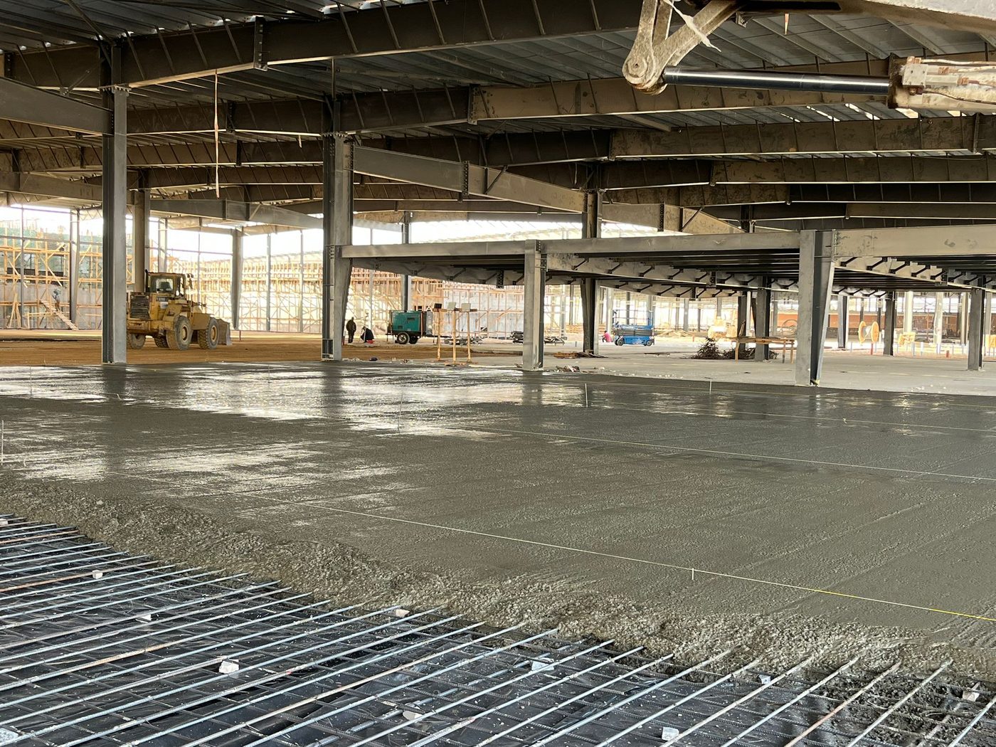 Fresh industrial floor slab in the steel hall