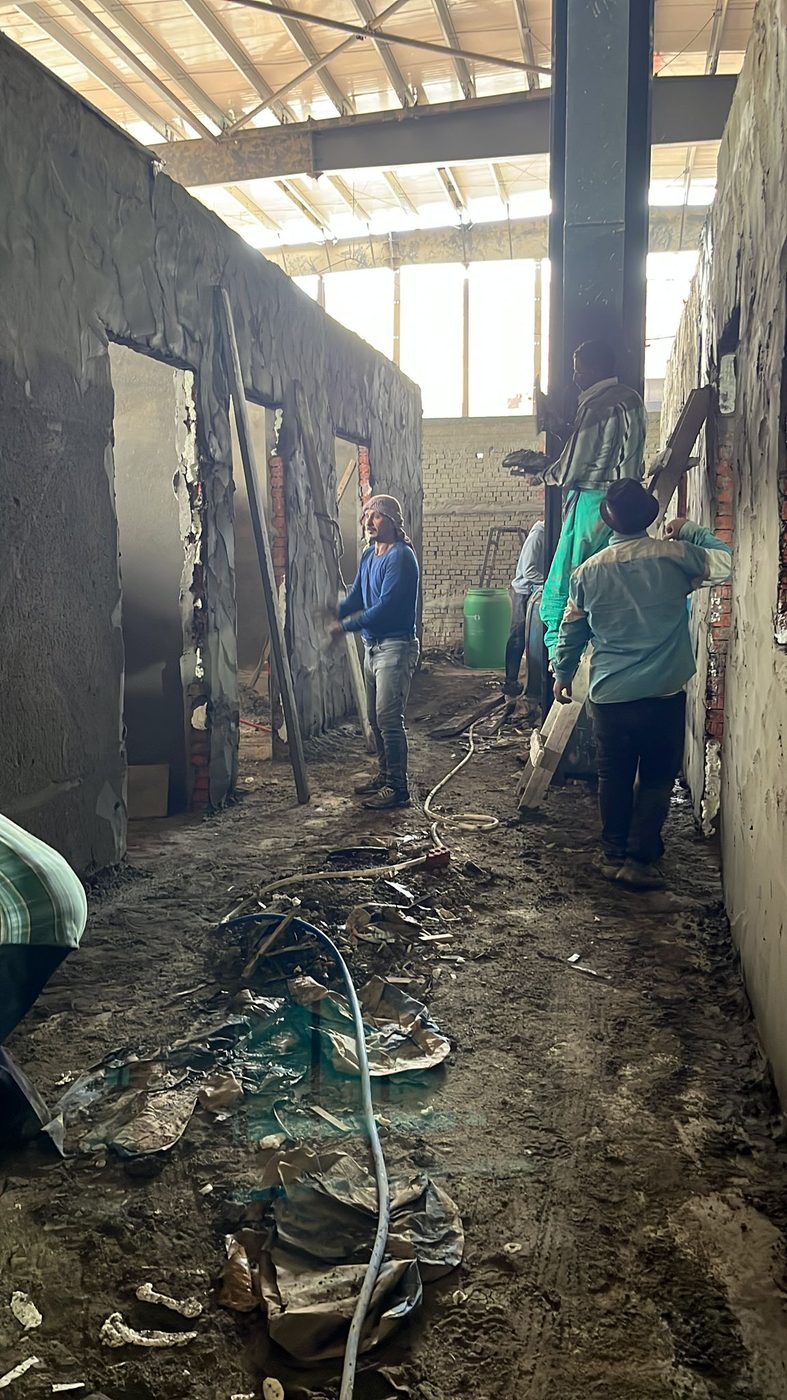Plastering crew on interior walls