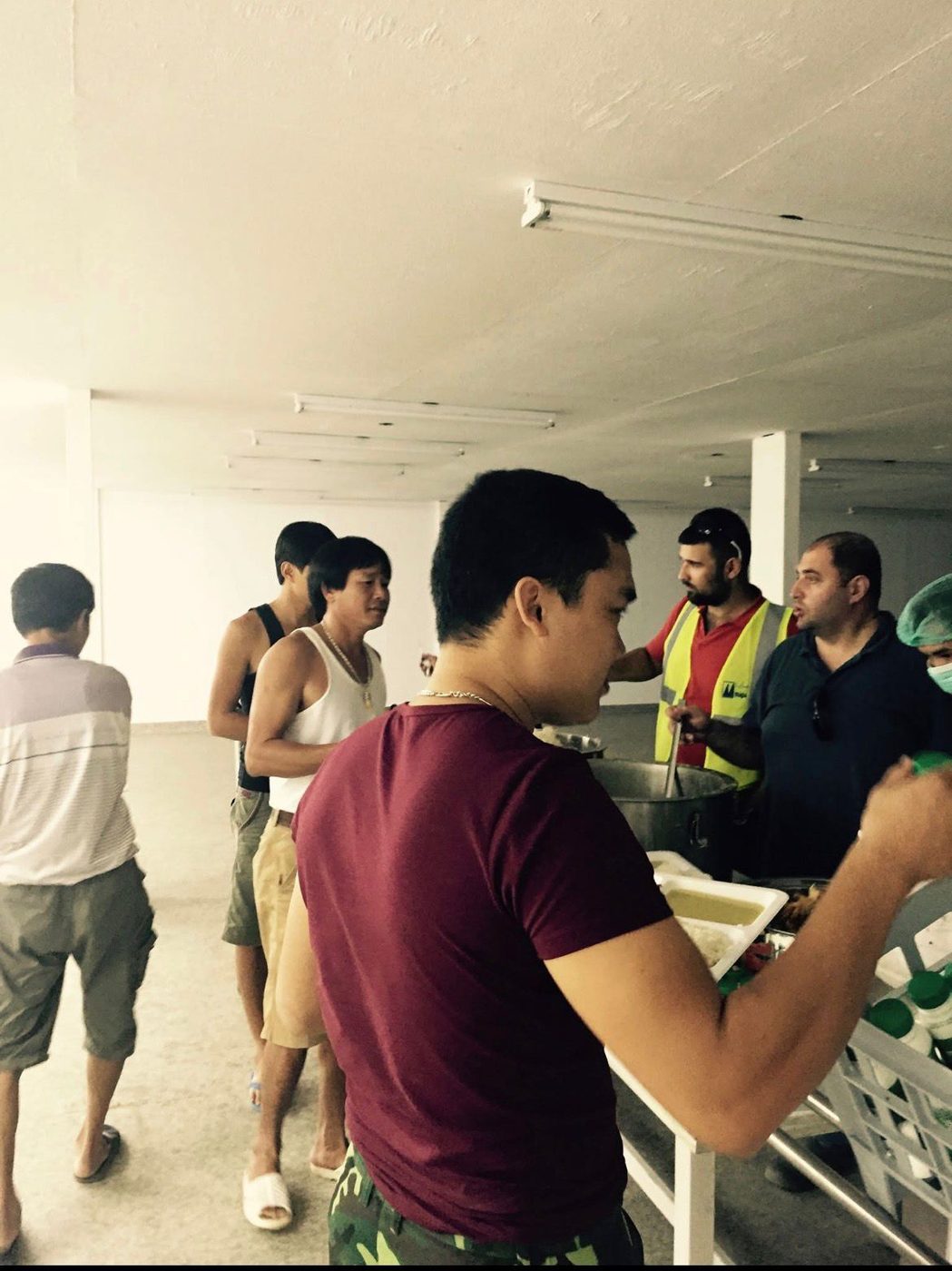 Daily hot meal service at the worker camp
