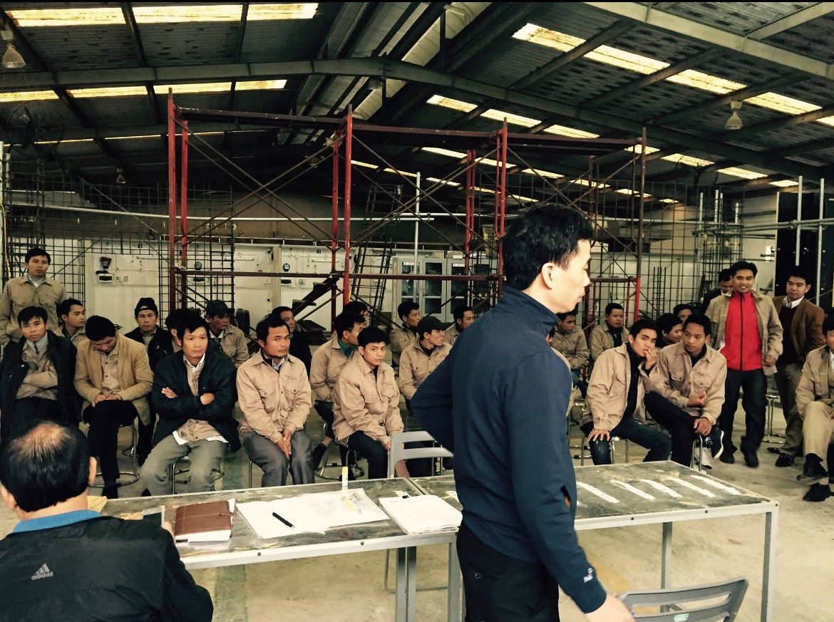 Worker briefing at the training hall